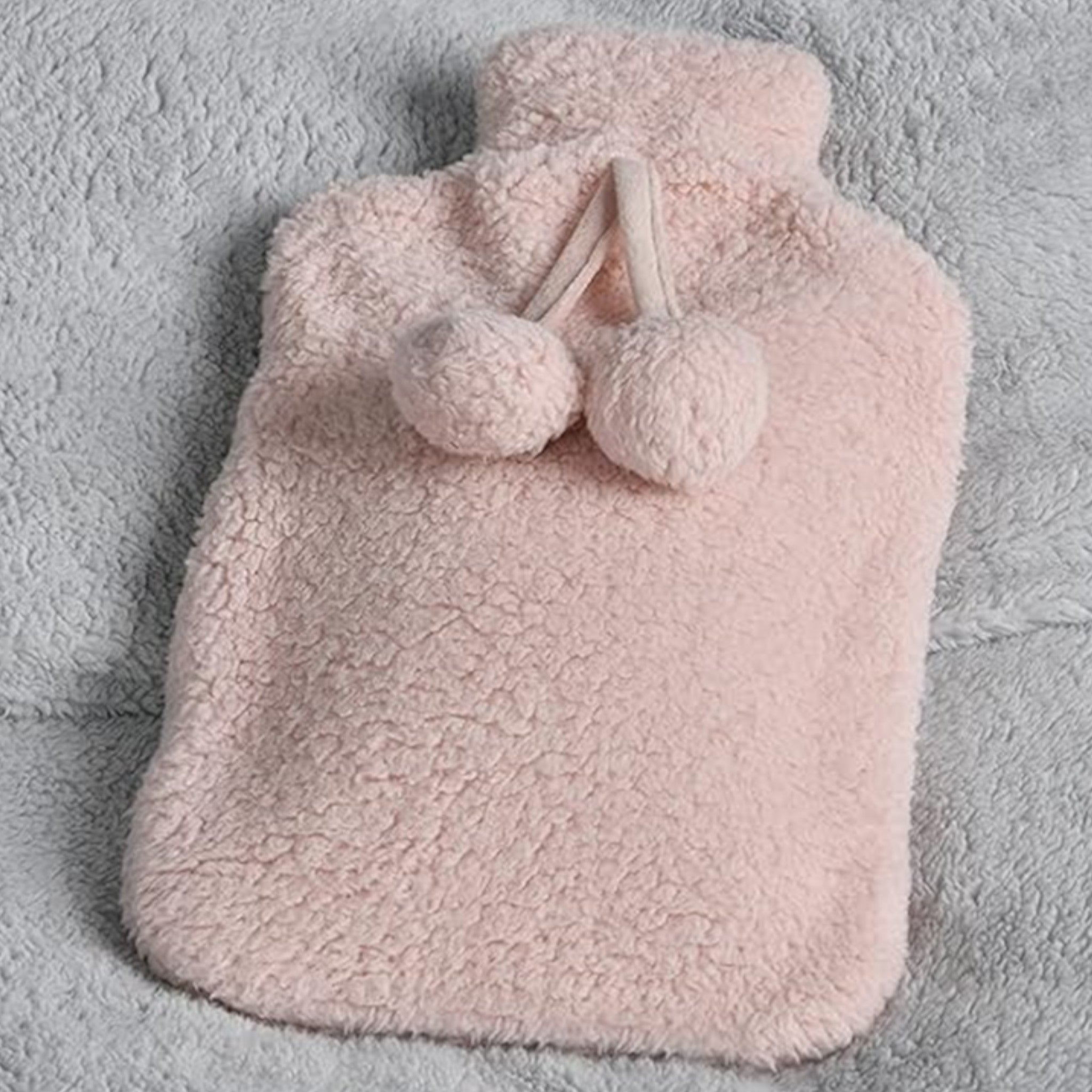Elite Heat hot water bottle with removable plush cover, perfect for winter in blush pink